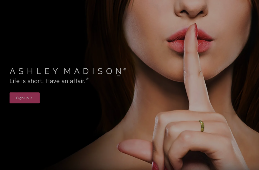 Ashley Madison's image on their webpage. A woman with her finger on her mouth as a 'shhh', clearly displaying that she's wearing a wedding ring. 